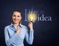 Woman holding bright bulb Royalty Free Stock Photo