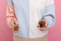 Woman holding brush with lost hair on pink background, closeup. Alopecia problem Royalty Free Stock Photo