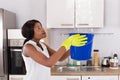 Woman Holding Bucket While Water Droplets Leak From Ceiling Royalty Free Stock Photo