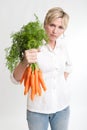 Woman holding a bunch of carrots Royalty Free Stock Photo