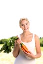 Woman holding bunch of carrots Royalty Free Stock Photo