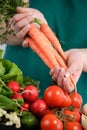 Woman holding a bunch of carrots Royalty Free Stock Photo