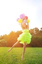 Woman holding bunch of colorful air balloons Royalty Free Stock Photo