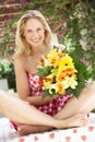 Woman Holding Bunch Of Flowers