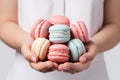 A Woman Holding A Bunch Of Macaroons In Her Hands Royalty Free Stock Photo