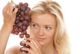 Woman holding bunch of red grapes