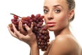 Woman holding a bunch of red grapes Royalty Free Stock Photo