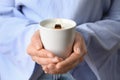 Woman holding burning candle with wooden wick, closeup Royalty Free Stock Photo