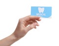 Woman holding business card on white, closeup. Dental medical service Royalty Free Stock Photo