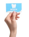 Woman holding business card on white, closeup. Dental medical service Royalty Free Stock Photo