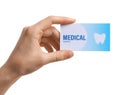 Woman holding business card isolated on white. Dental medical service Royalty Free Stock Photo