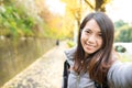 Woman holding camera to take photo