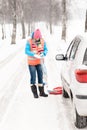 Woman holding car chains winter tire snow Royalty Free Stock Photo