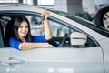 Woman holding car keys sitting in new car Royalty Free Stock Photo