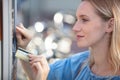 woman holding card to make payment in outdoor machine Royalty Free Stock Photo