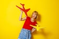 Woman holding cardboard plane as air travel concept Royalty Free Stock Photo