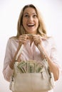 Woman Holding Cash Filled Purse Royalty Free Stock Photo