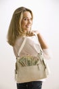 Woman Holding Cash Filled Purse