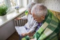 Woman holding cash in front of heating radiator. Payment for heating in winter. Selective focus.