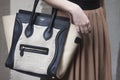 A woman holding a Celine handbag. Royalty Free Stock Photo