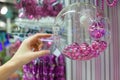 Woman holding Christmas glass bowl with small pink Royalty Free Stock Photo