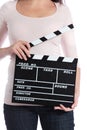 Woman holding clapperboard