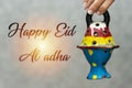 woman holding clay lantern. happy eid al adha concept.