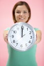 Woman Holding Clock Showing 12 O'Clock Royalty Free Stock Photo