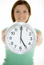 Woman Holding Clock Showing 5 O'Clock Royalty Free Stock Photo