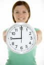 Woman Holding Clock Showing 9 O'Clock Royalty Free Stock Photo