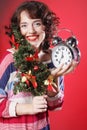 Woman holding clock and the tree Royalty Free Stock Photo