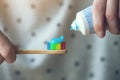 Woman holding colorful eco-friendly bamboo toothbrush and toothpaste Royalty Free Stock Photo