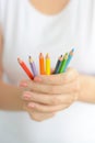 Woman holding colorful pencils in hand Royalty Free Stock Photo