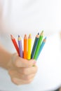 Woman holding colorful pencils in hand Royalty Free Stock Photo