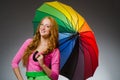 Woman holding colourful umbrella Royalty Free Stock Photo