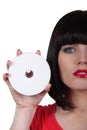 Woman holding a compact disc Royalty Free Stock Photo