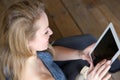 Woman holding computer tablet at home