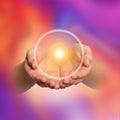 Woman holding concentrated healing energy in hands, closeup