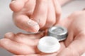 Woman holding contact lens and case Royalty Free Stock Photo