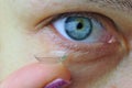 Woman eye with contact lens