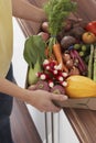 Woman Holding Container Full Of Fresh Vegetables