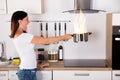 Woman Holding Cooking Pot With Fire