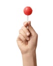 Woman holding coral lollipop against white background