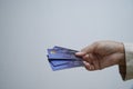 Woman holding credit card in her  hand over white background Royalty Free Stock Photo