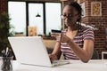 Woman holding credit card, making payment in online store Royalty Free Stock Photo