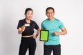 woman holding credit card and man showing camera tablet screen