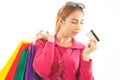 Woman holding credit card and shopping bags