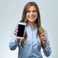 Woman holding credit card and smartfone