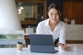 Woman holding credit card and using computer tablet for online payment or online shopping. Royalty Free Stock Photo