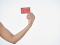 Woman holding credit card on white background Royalty Free Stock Photo